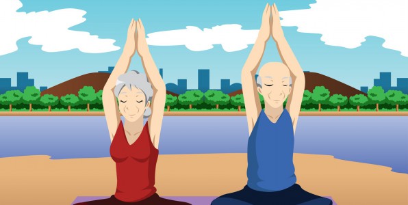 Un couple de personnes ges faisant du yoga.